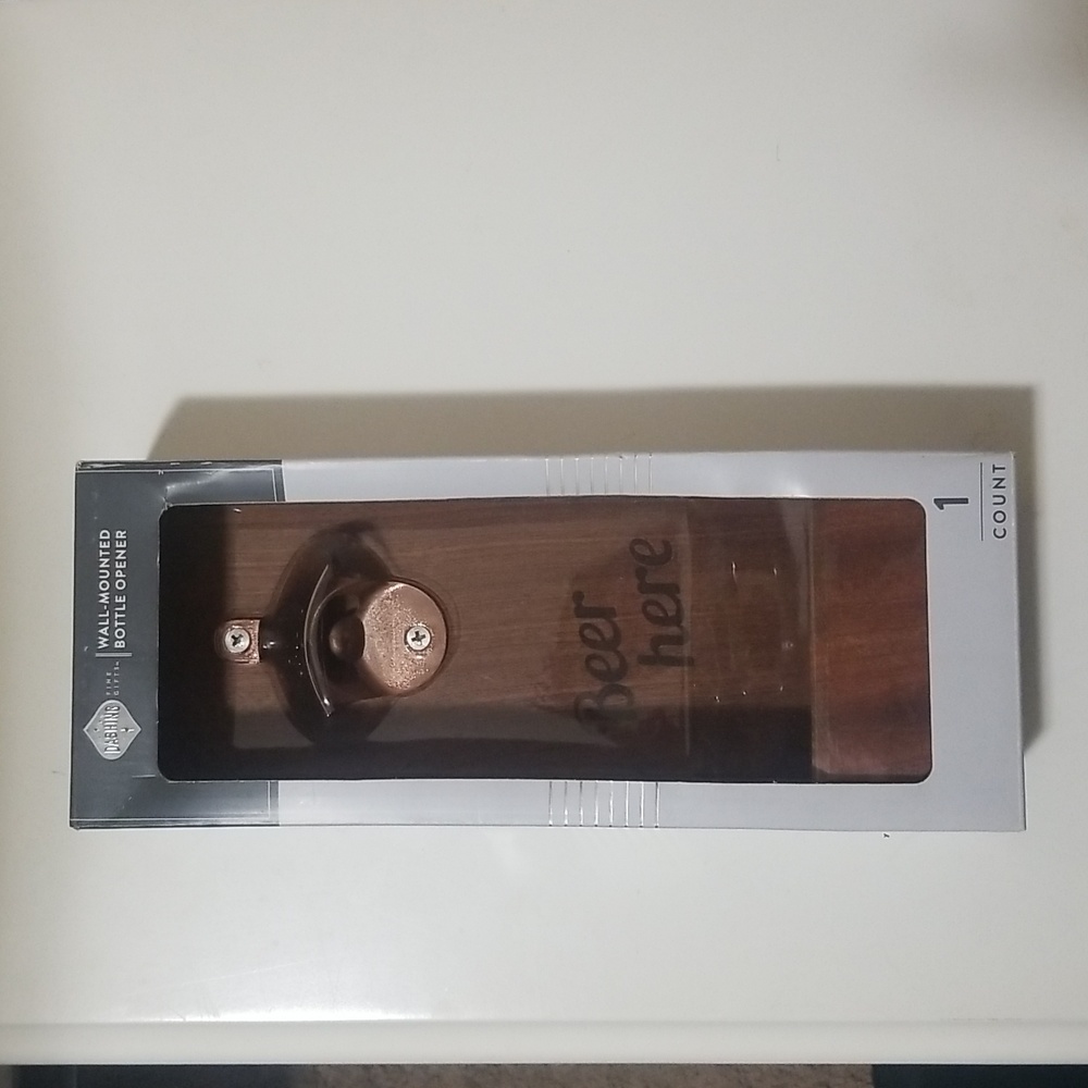 Wall mounted bottle opener